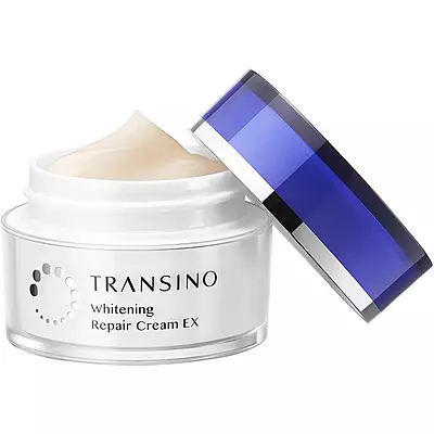 Night skincare routine featuring Transino Repair Cream EX — applying after toner/serum